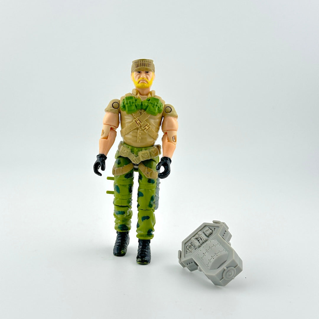 GI Joe action figure with accessory on white background. 