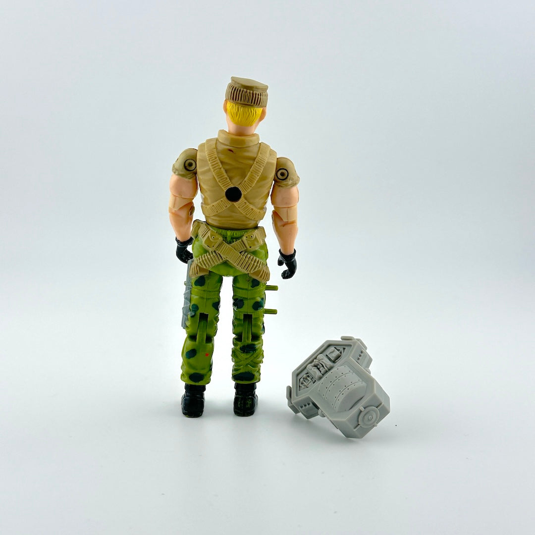 Action figure in military-style outfit with a weapon on a white background