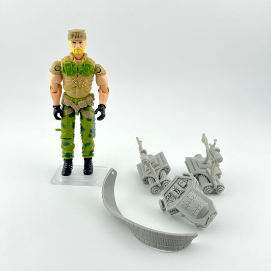GI Joe action figure with accessories against white background.