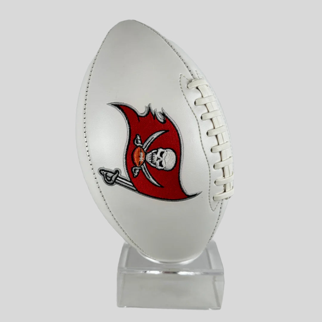 White football with a red and black logo on a clear stand against a light gray background