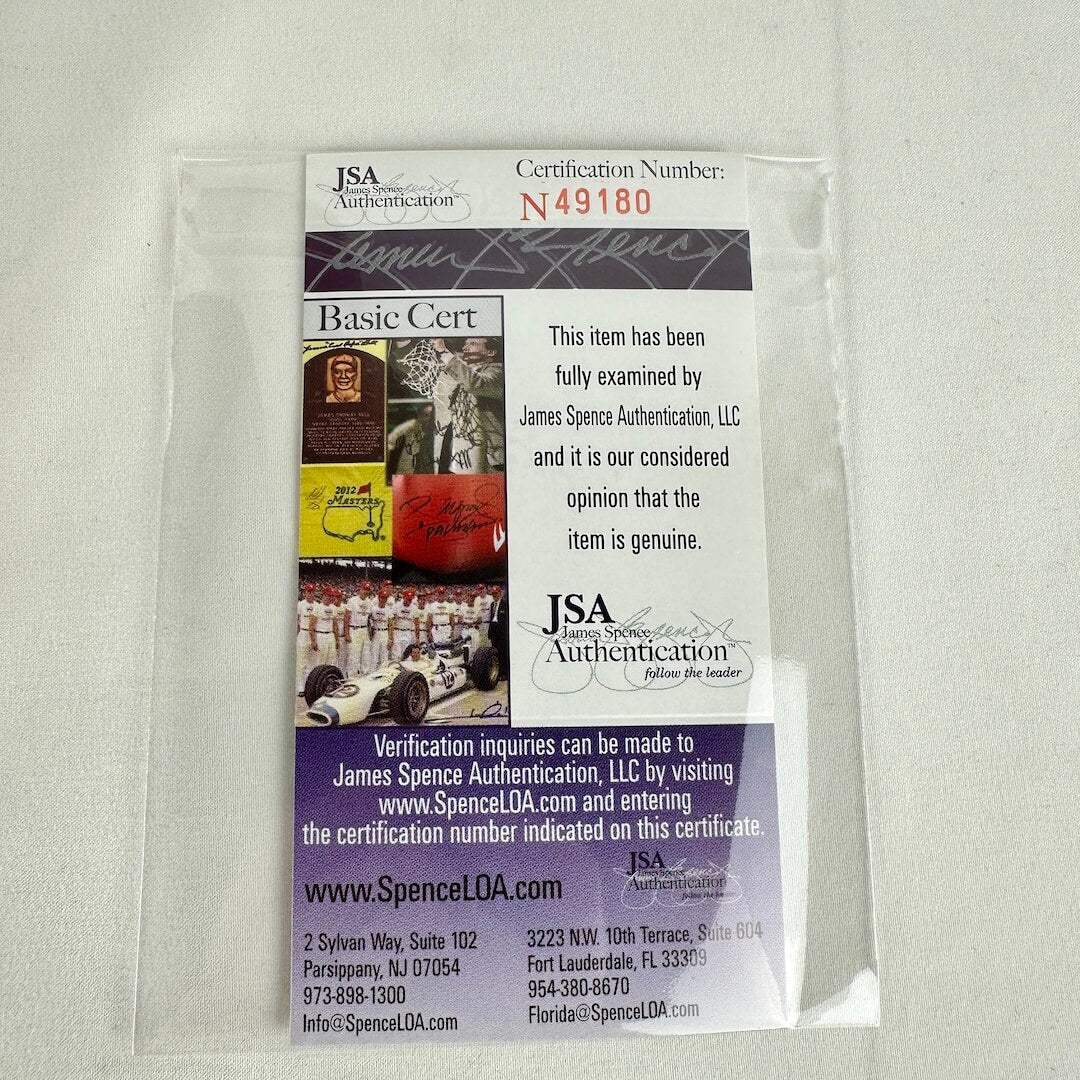 Close up of authentication certificate from JSA in protective sleeve.