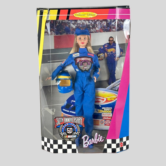 Barbie doll in racing uniform with packaging featuring a race car and people.