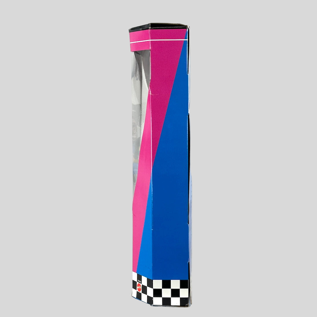 Side view of Barbie's brightly colored box. 