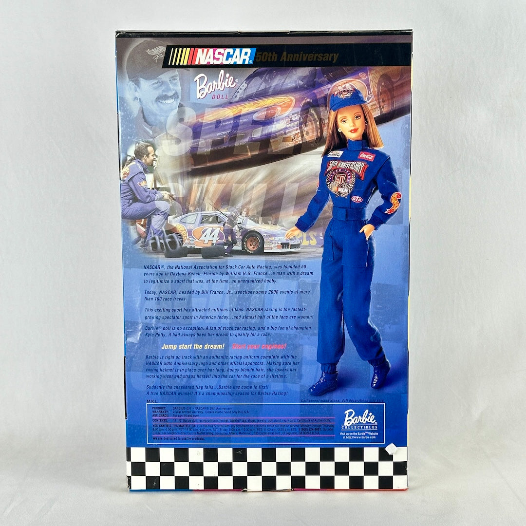Barbie doll in Nascar uniform packaging with race car and driver on a white background