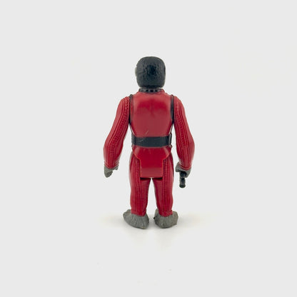 Toy figure in a red suit on a white background