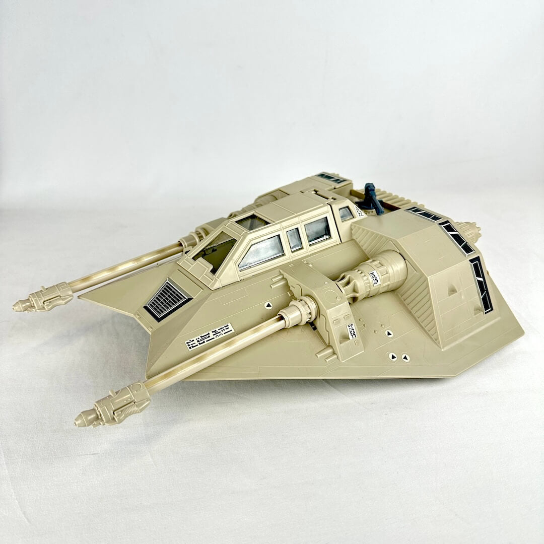 Toy snowspeeder model/toy on a white background, side view. 