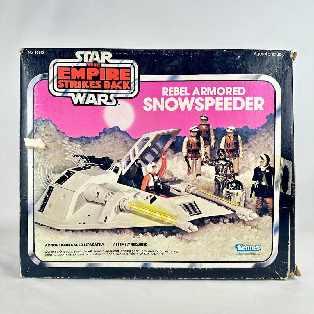Vintage 'Star Wars' Rebel Armored Snowspeeder toy packaging with characters and text.