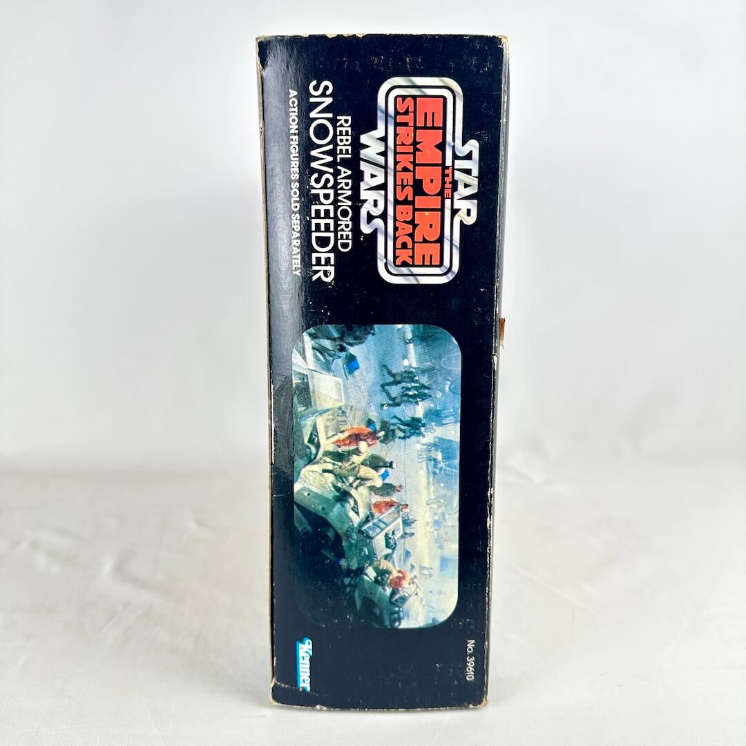 Vintage Star Wars toy box with 'Empire Strikes Back' branding on a white background