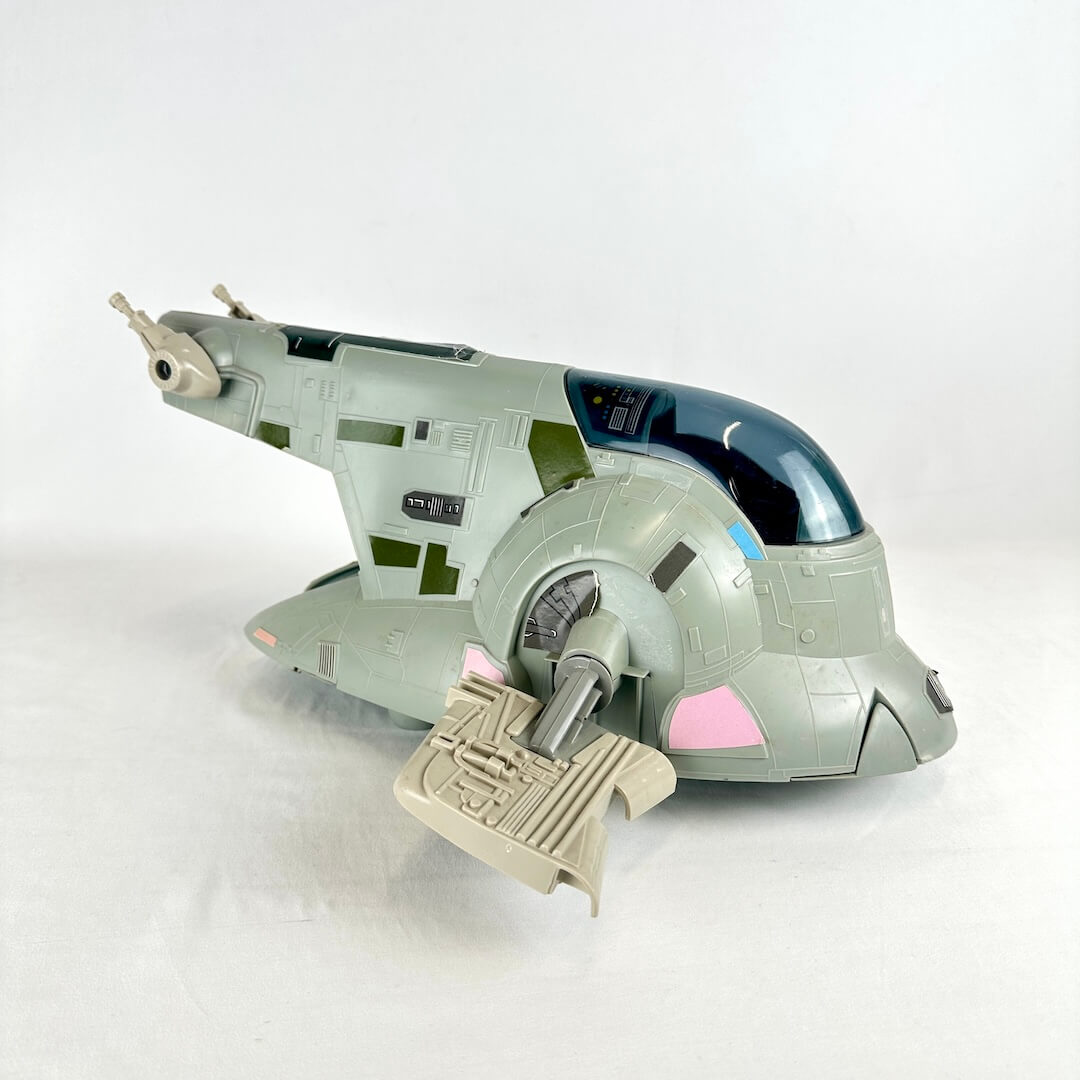 Toy spaceship model on a white background