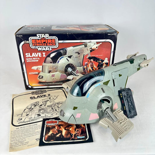 Vintage Star Wars Slave I toy with packaging and accessories on a white background