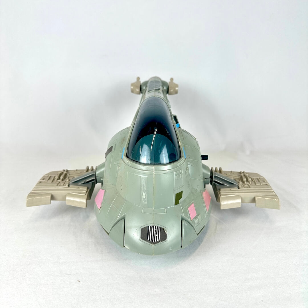 Toy spaceship model on a white background