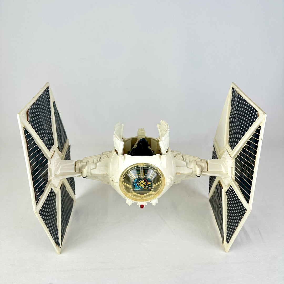 Front view of ship with cockpit doors open, one sticker missing off right wing. 