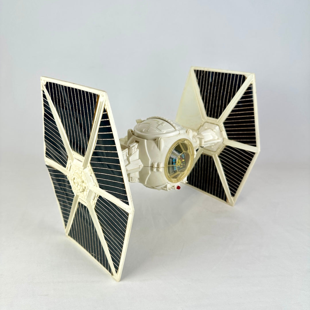 Side view of TIE fighter spaceship with one missing sticker on right wing. 