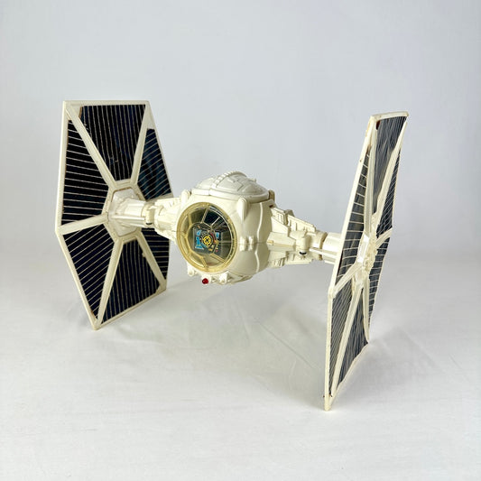 White spaceship with spherical cockpit and two hexagonal wings on either side with black stickers in each section. 