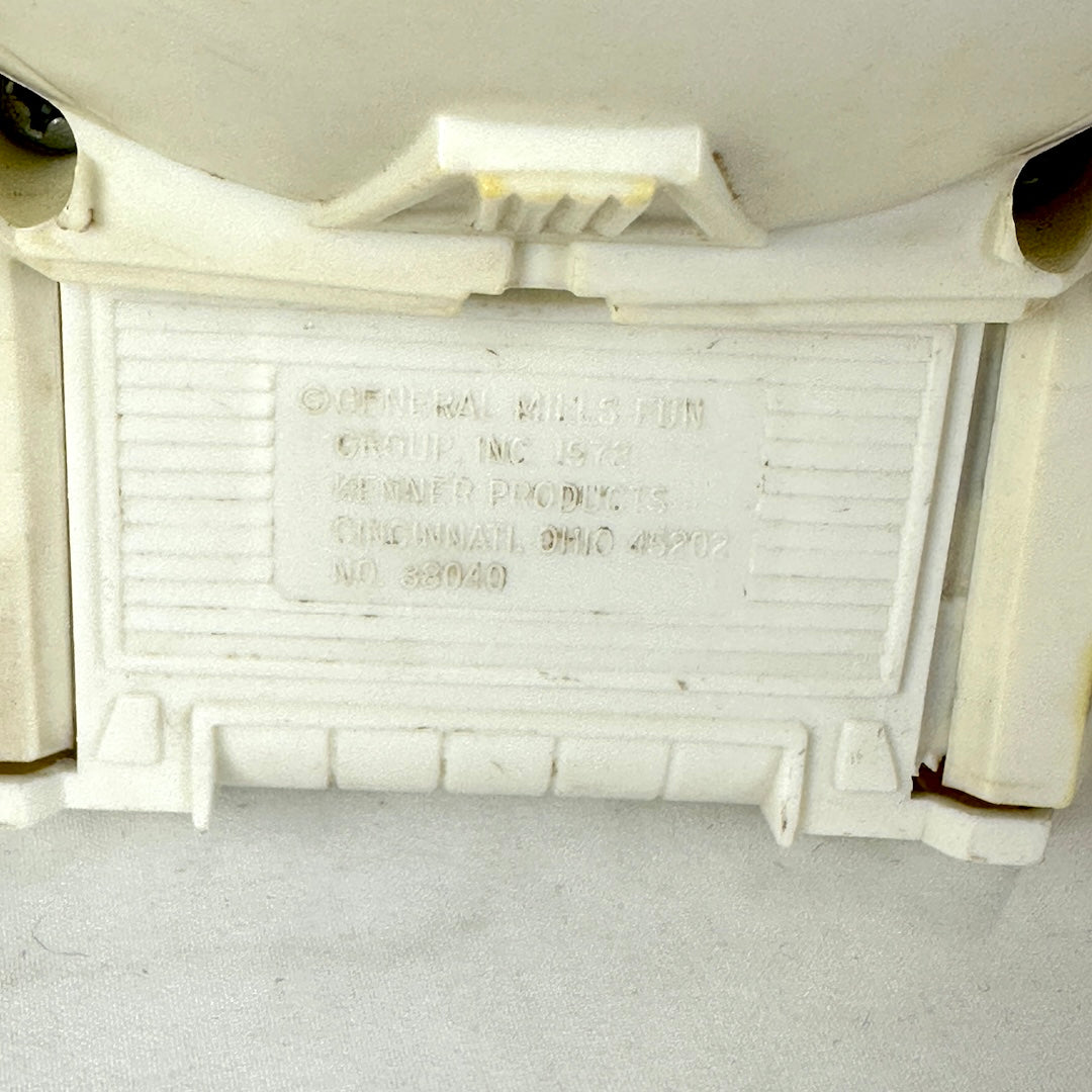 Close up of embossed copyright information on backside of ship. 