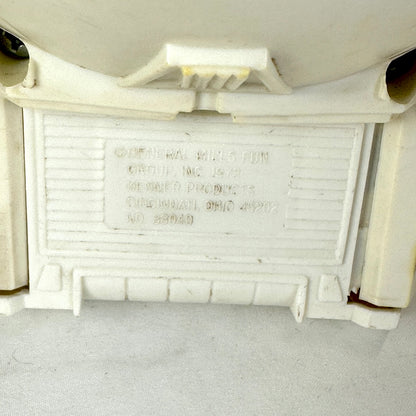 Close up of embossed copyright information on backside of ship. 