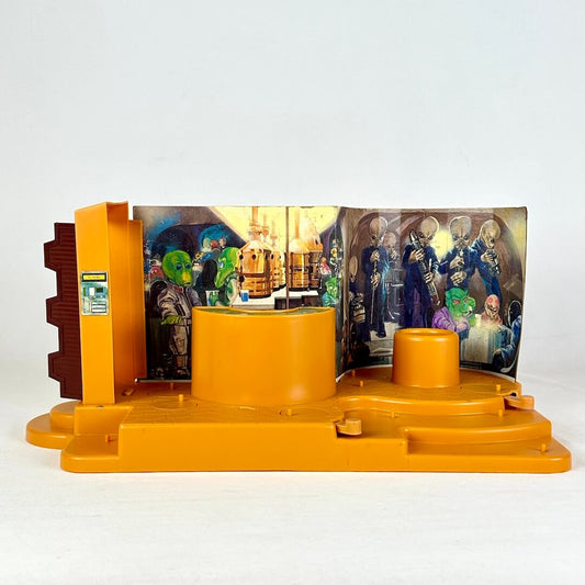 Star Wars Cantina playset with orange base and background with colorful characters against white backdrop. 