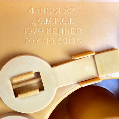 Close up of copyright information embossed on bottom of base. 