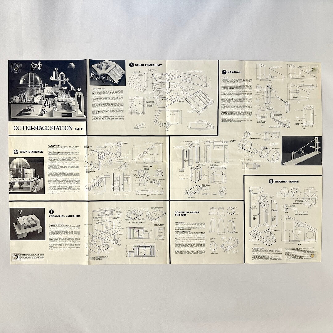 Set of vintage model kit instructions for an outer-space station on a white background