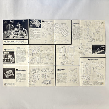Set of vintage model kit instructions for an outer-space station on a white background