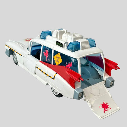 Toy vehicle with red and blue details on a light gray background