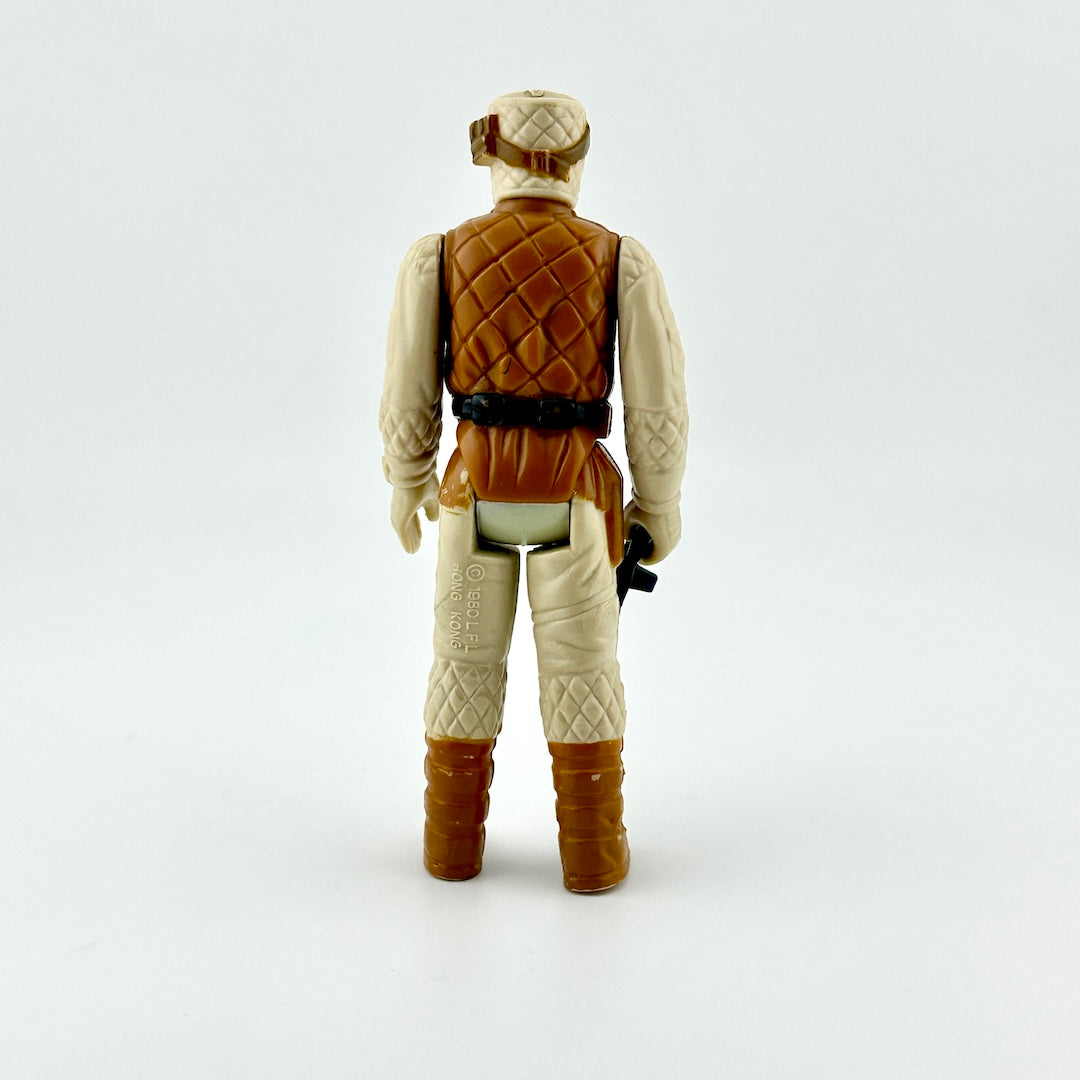 Action figure of soldier in Hoth fatigues holding dark blue gun against white background.
