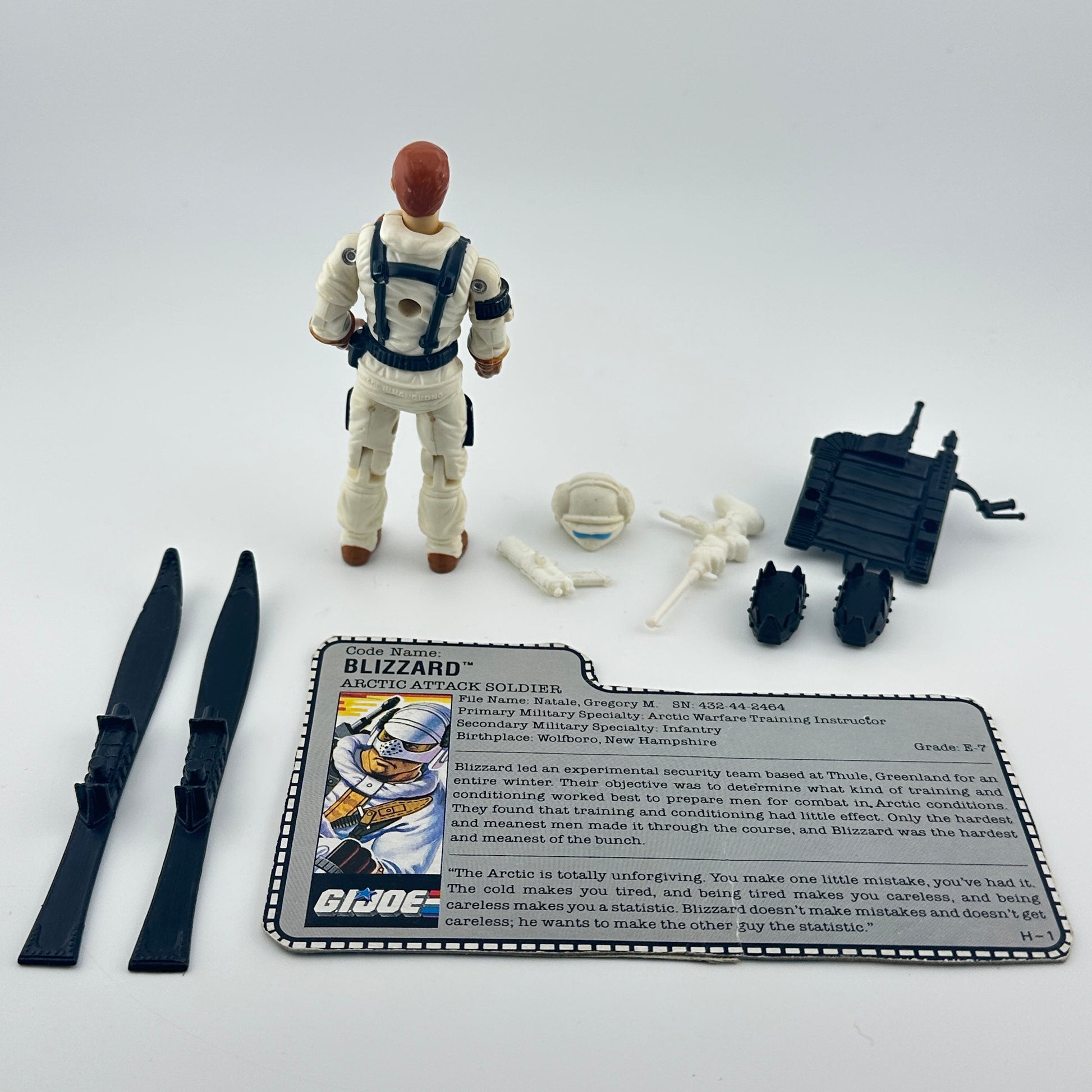 G.I. Joe action figure with accessories and character card on a white background