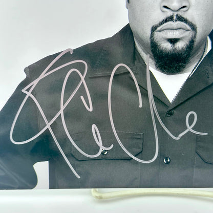 Close up of silver marker signature on shoulder and chest of photo of Ice Cube.