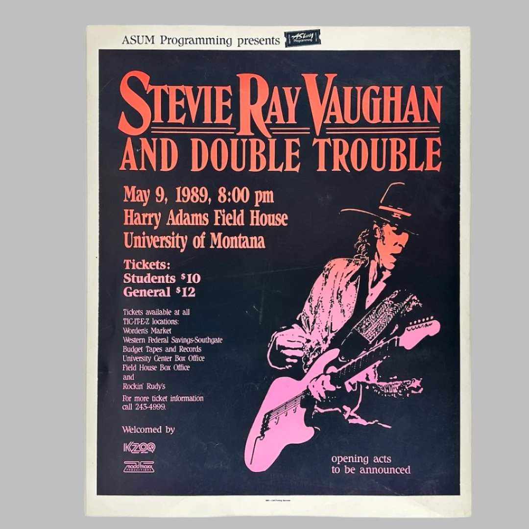 Black poster with white border. Man with hat playing guitar. Font colors fade from orange to pink.