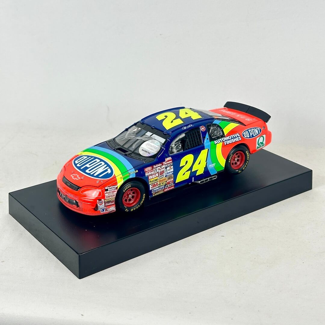 Diecast car with Dupont and 24 branding with signature on windshield and rear window. 