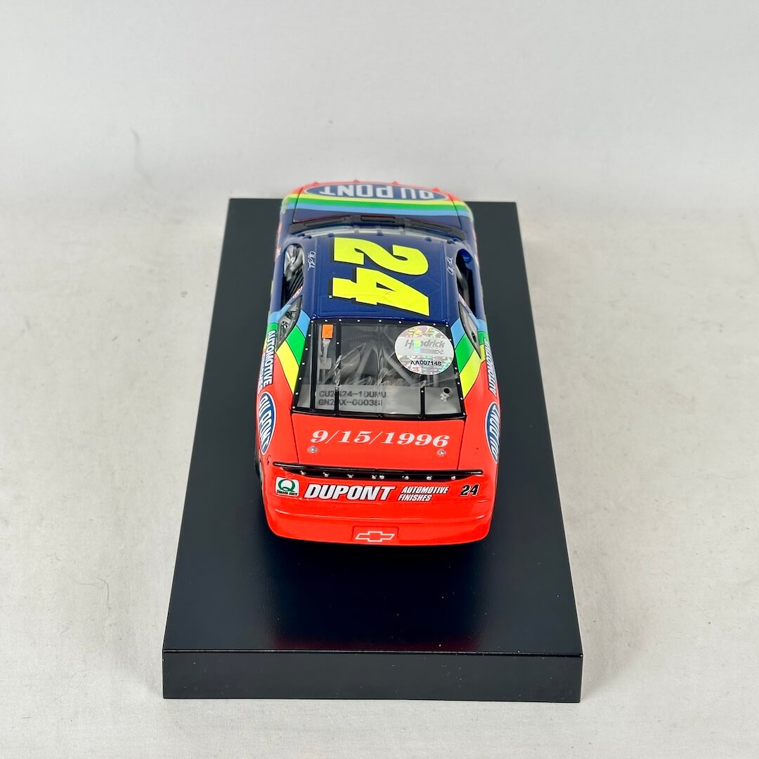 Back view of diecast car with Dupont branding. 