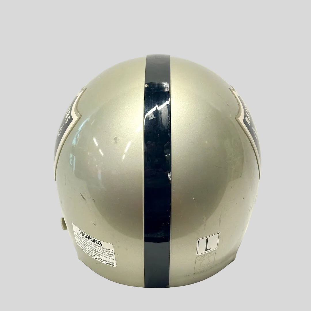 Backside of silver football helmet with black stripe down center, shown on white background. 