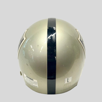 Backside of silver football helmet with black stripe down center, shown on white background. 