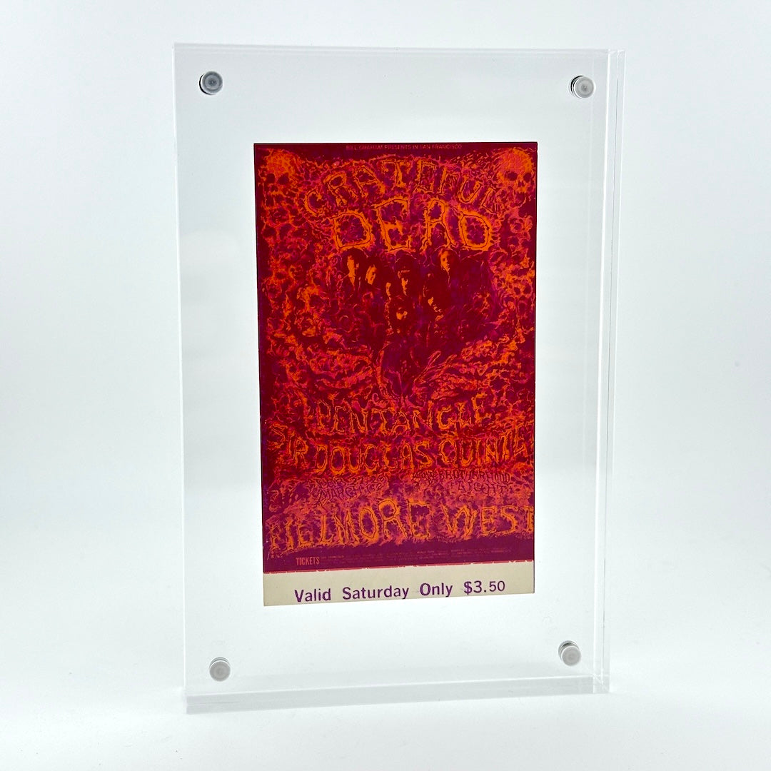 A clear acrylic display frame holding a red and orange psychedelic concert poster that reads 'Grateful Dead'.