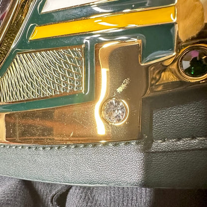 Scratch by bottom right screw on center plate. 