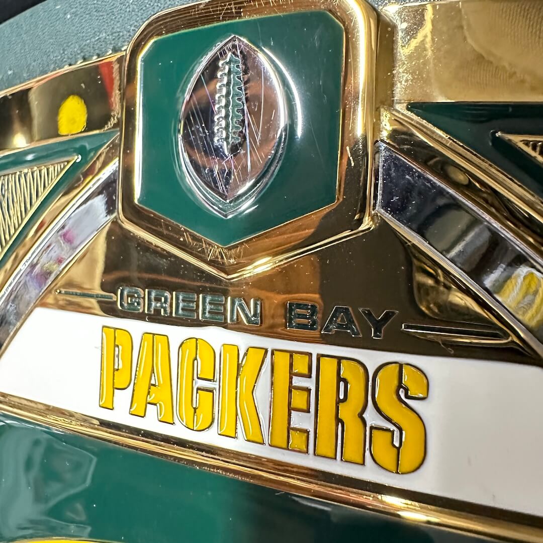 Scratches on football emblem at top of center plate. 