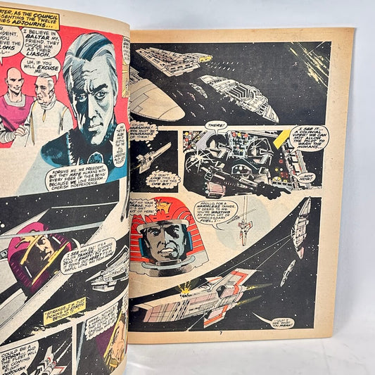 An open vintage comic book showing two printed pages with illustrated sci-fi space scenes, spacecraft, and comic panels.