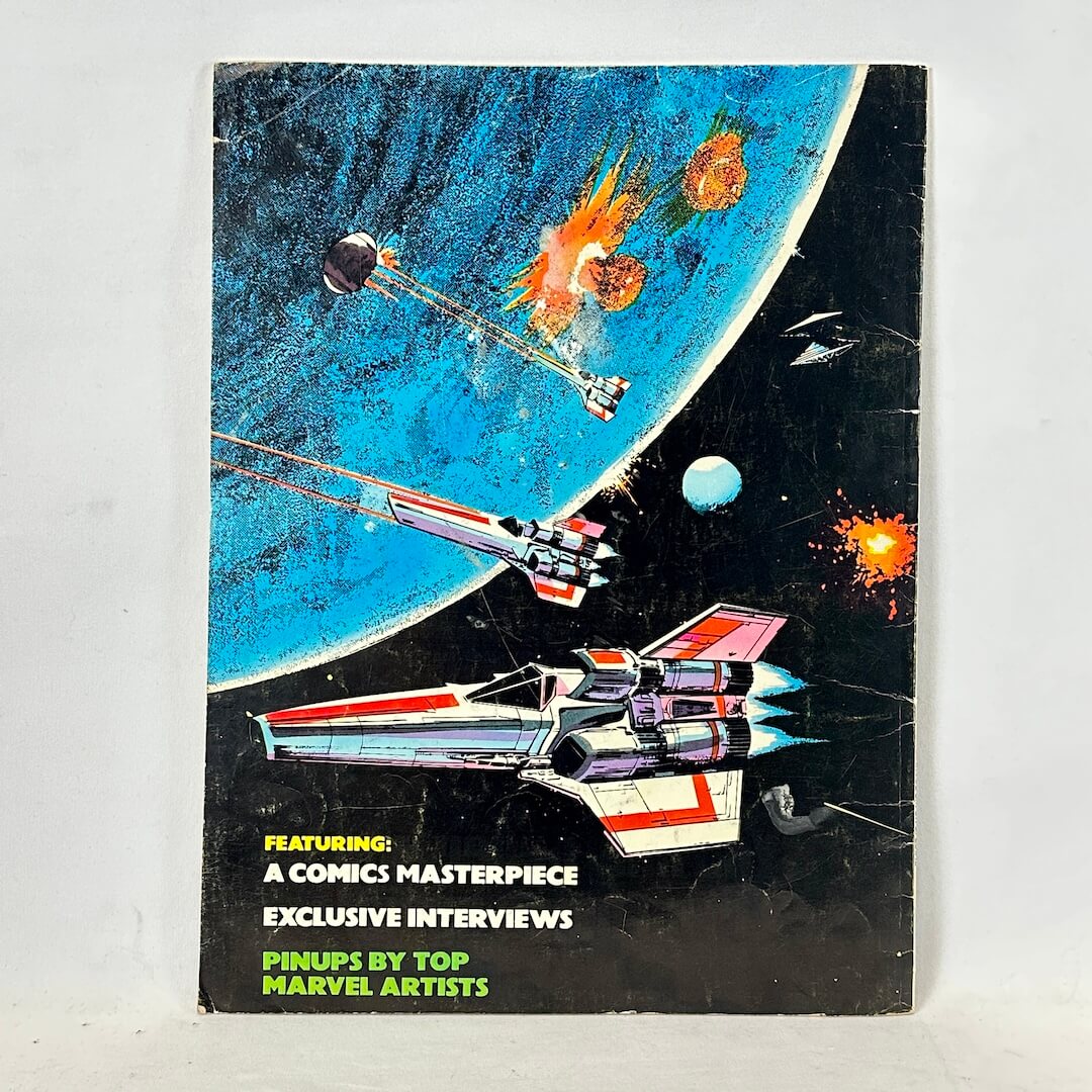 Vintage comic book back cover featuring space-themed artwork with multiple futuristic spacecraft.