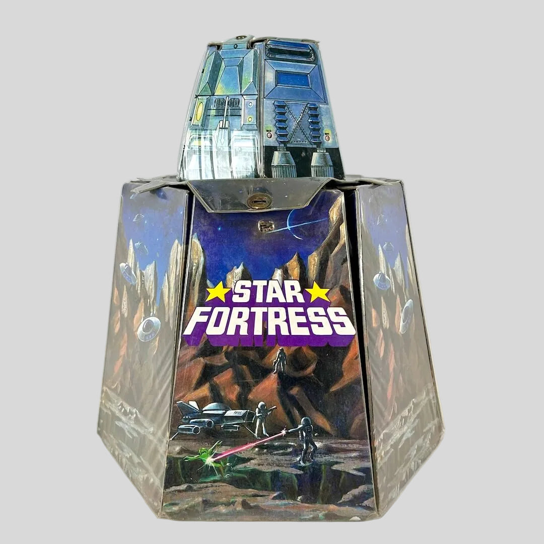 Vintage Star Fortress toy set with a blue metallic fortress structure on top of a sci-fi/space themed structure. 