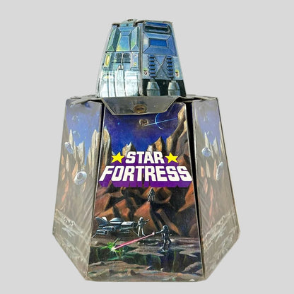 Vintage Star Fortress toy set with a blue metallic fortress structure on top of a sci-fi/space themed structure. 