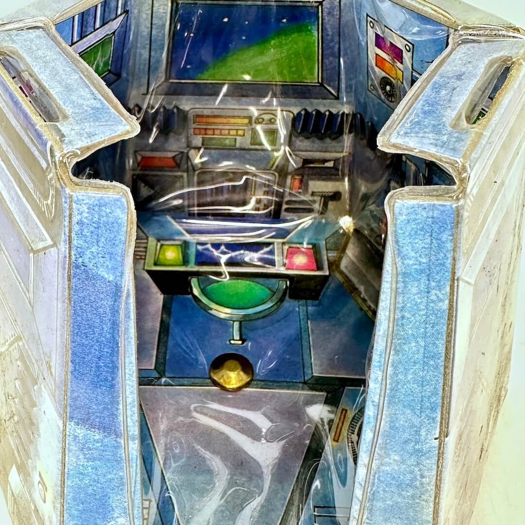 Close-up view of inside smaller section to show decorative control panel and screens. 