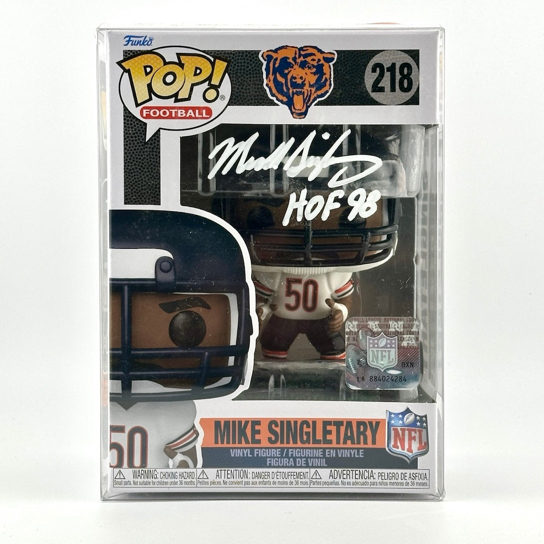 Vinyl figure of Mike Singletary in white Chicago Bears jersey in original packaging signed by him in white marker.