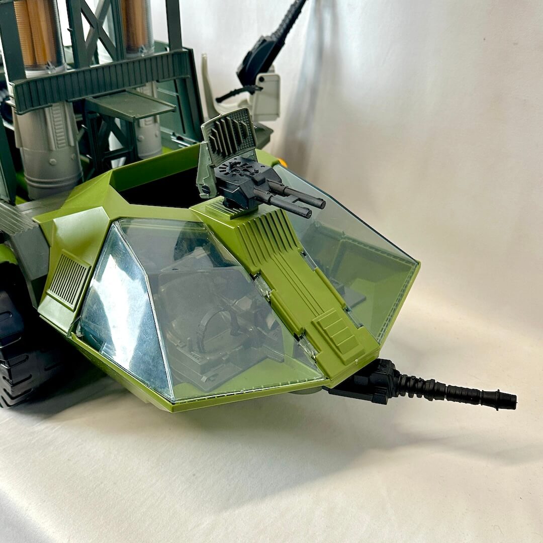 Toy robot with green and black design on a light background