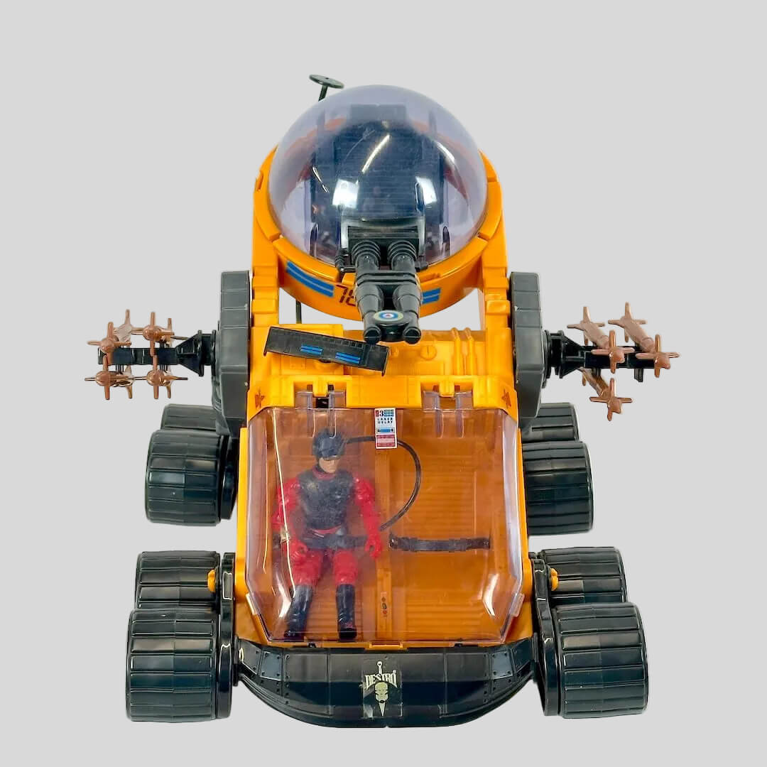 Toy vehicle with a transparent cabin containing a figure on a white background