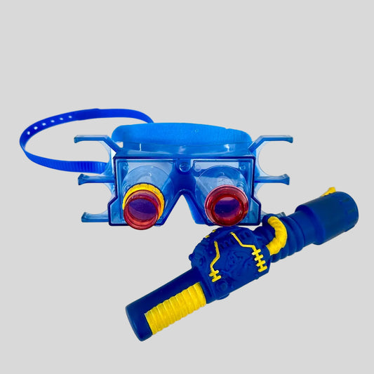 Blue goggles with red lenses and yellow accents on a white background