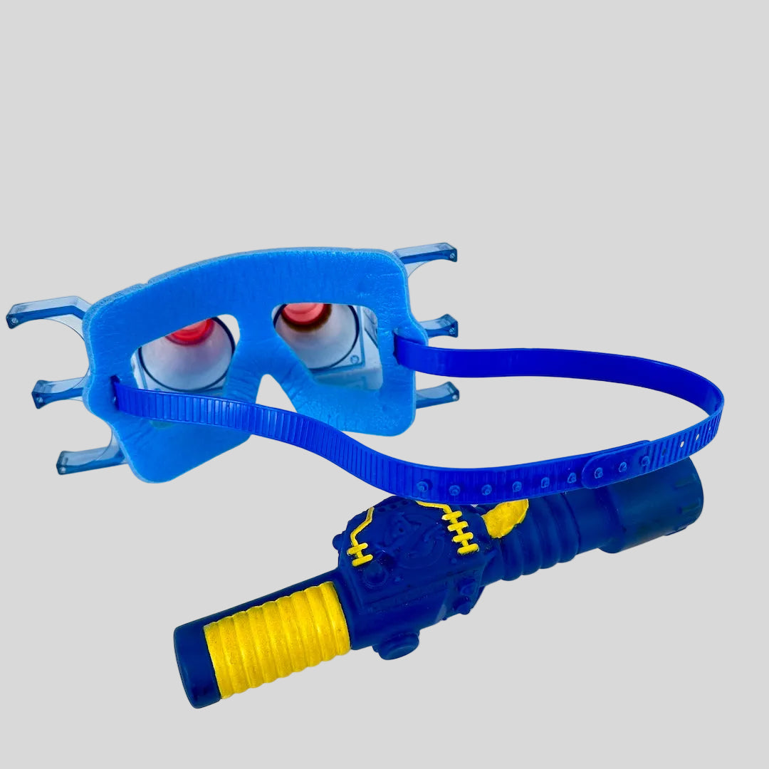 Blue and yellow toy gun with a mask on a white background