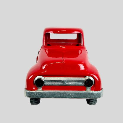 Red toy truck on a white background