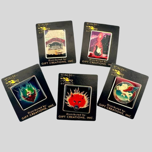 Five hard enamel pins featuring art by Stanley Mouse on black card backs with gold text & logos.