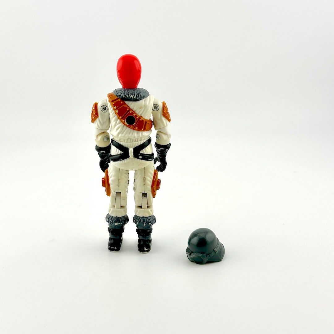 Toy figure of a character with a red helmet and white outfit on a white background