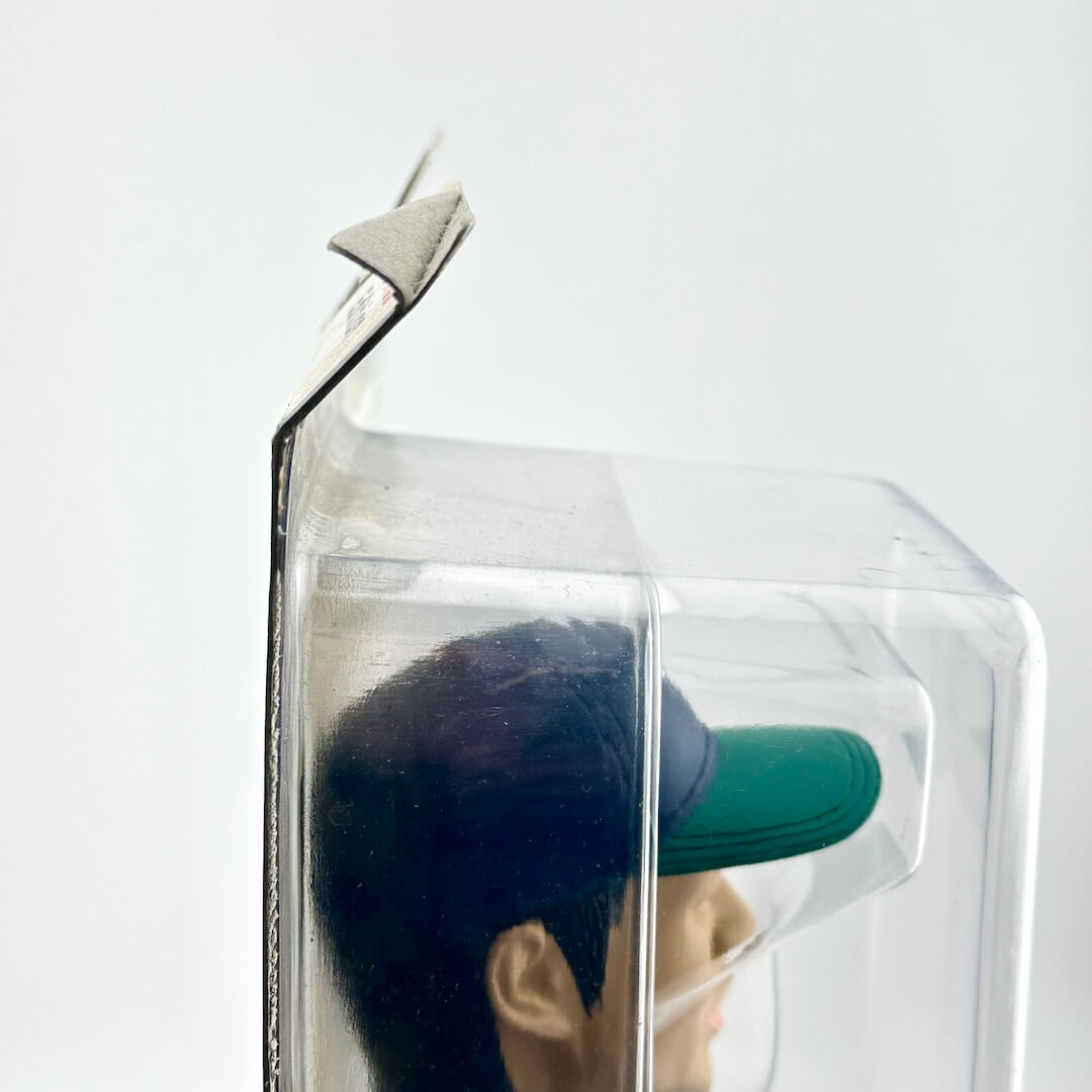 Packaging containing bobblehead on a white background